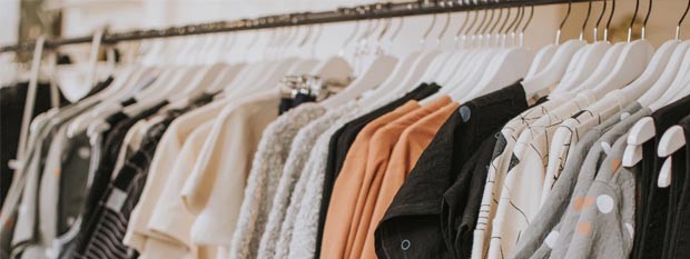 A clothes rail full of designer women's clothes